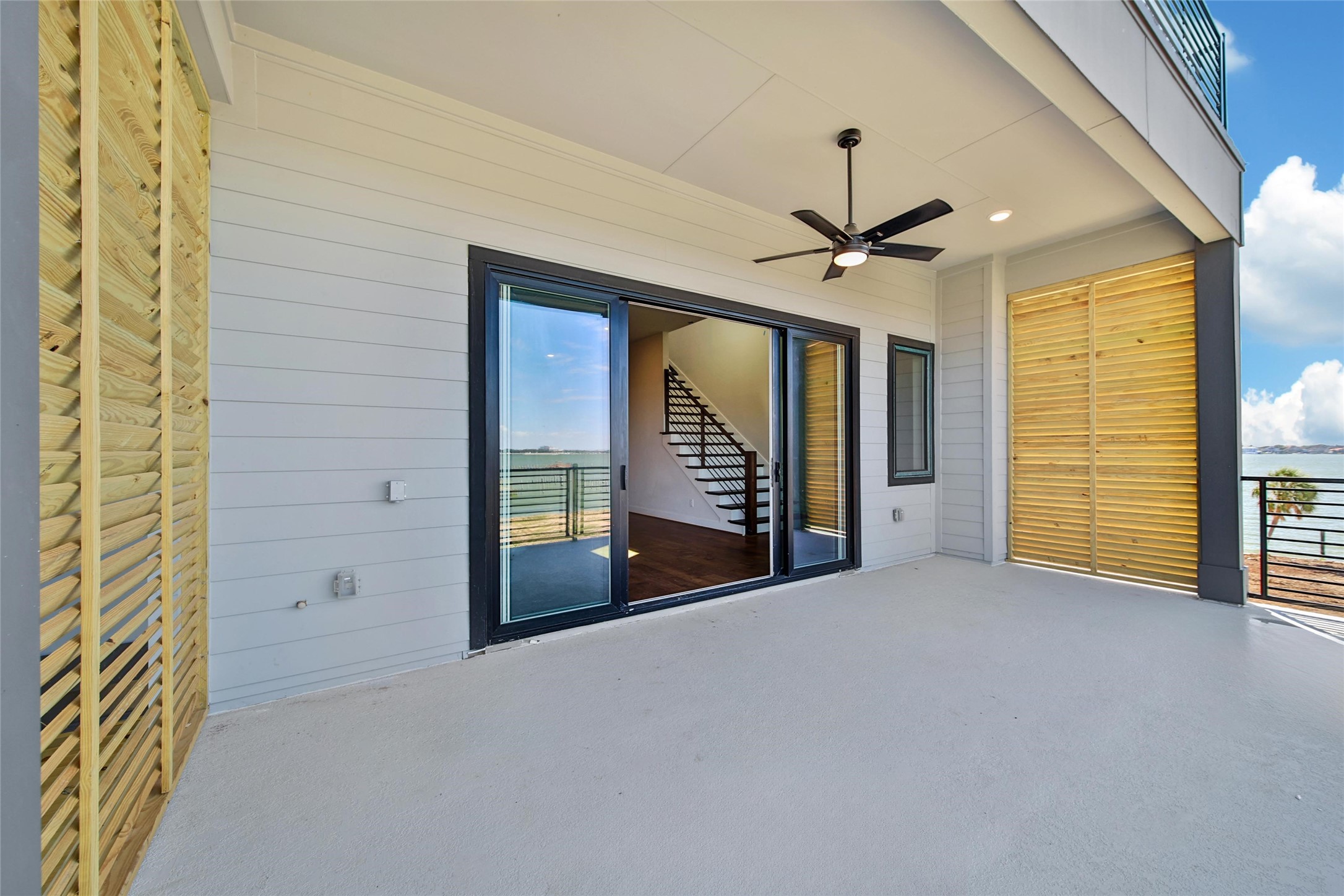 4412 Tucker Lane Seabrook, TX 77586 - Photo 32 of 41 a view of a livingroom with a chandelier fan and a fireplace
