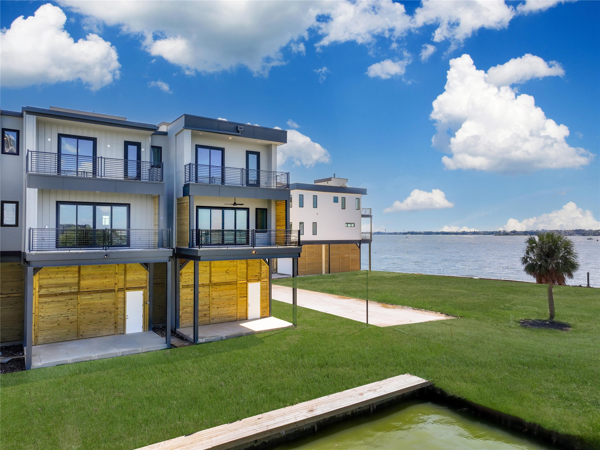 4412 Tucker Lane Seabrook, TX 77586 - Photo 37 of 41 a view of a house with a swimming pool and a yard