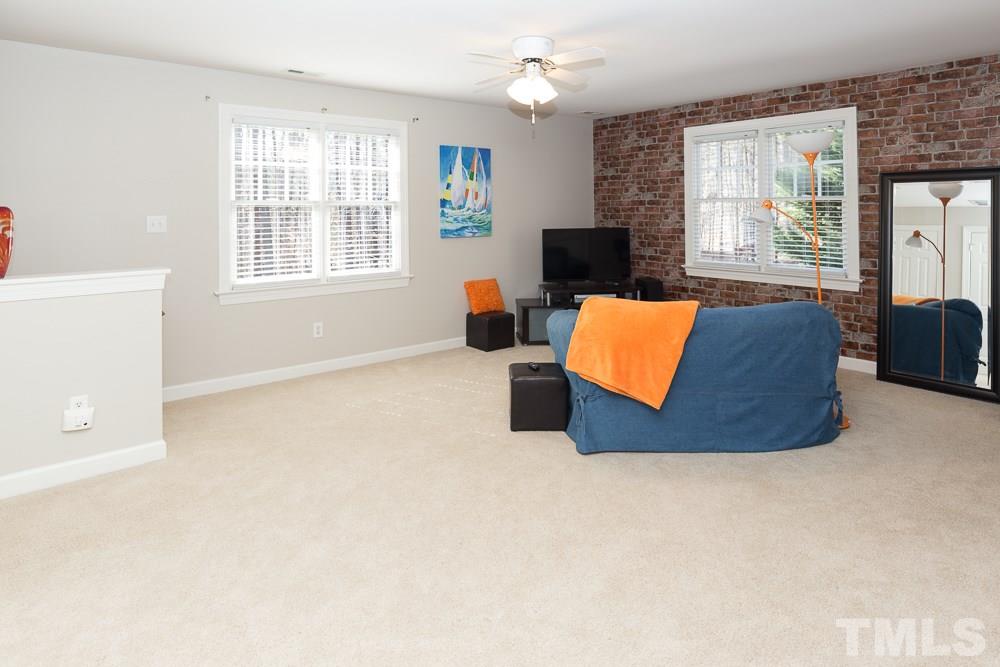 5817 North Hawthorne Way Raleigh, NC 27613 - Photo 20 of 25 a room with furniture and a large window