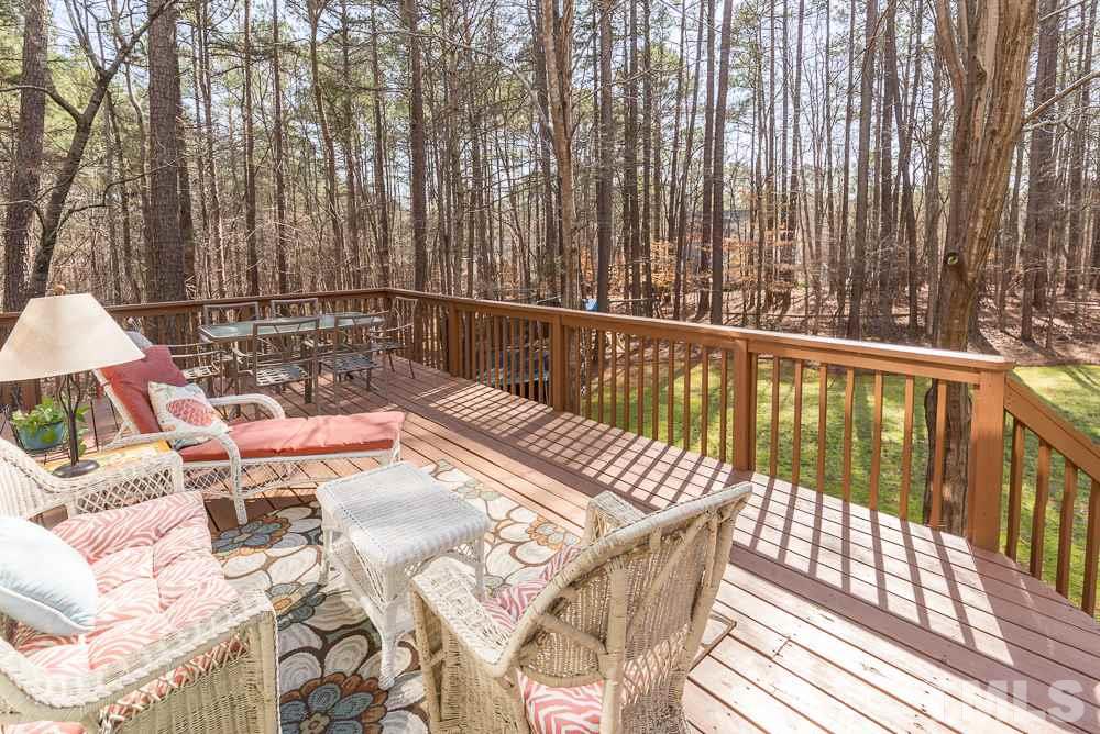 5817 North Hawthorne Way Raleigh, NC 27613 - Photo 22 of 25 a view of balcony with wooden floor and outdoor seating