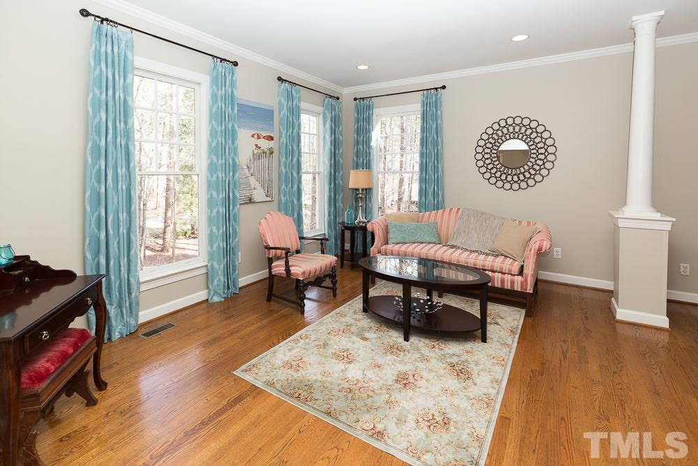 5817 North Hawthorne Way Raleigh, NC 27613 - Photo 4 of 25 a living room with furniture and a window