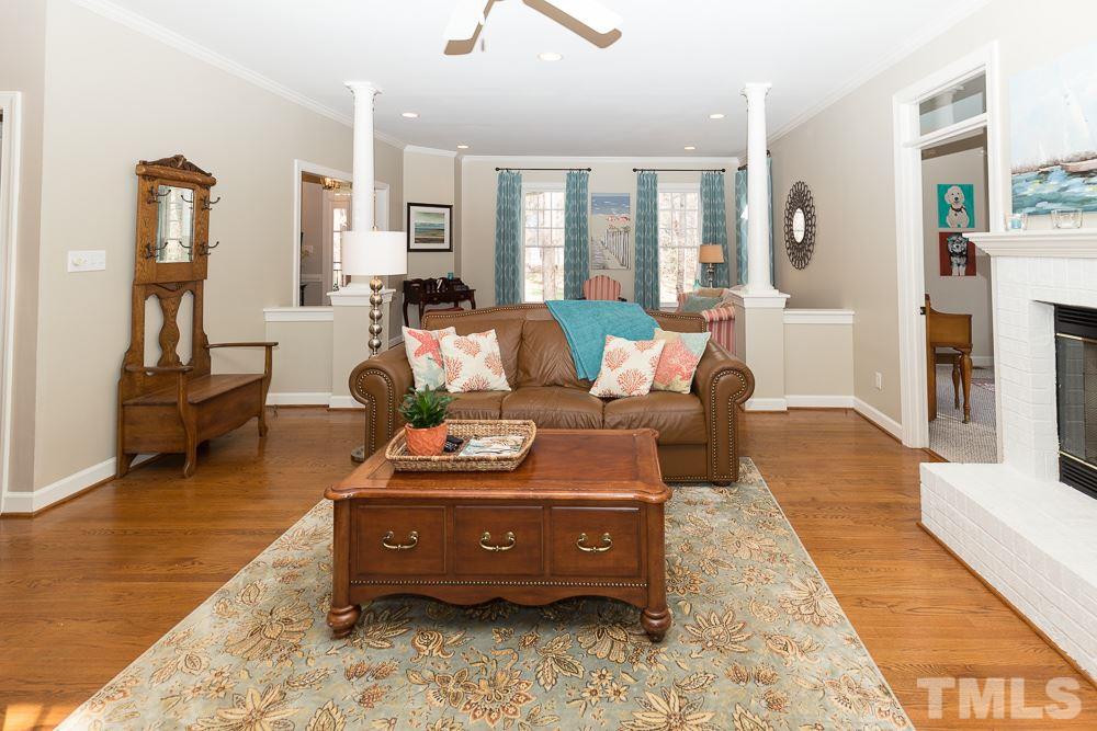 5817 North Hawthorne Way Raleigh, NC 27613 - Photo 5 of 25 a living room with furniture window and wooden floor