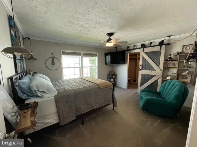 a bedroom with furniture and a window