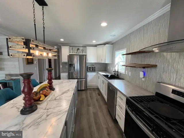 a kitchen with lots of counter top space and appliances