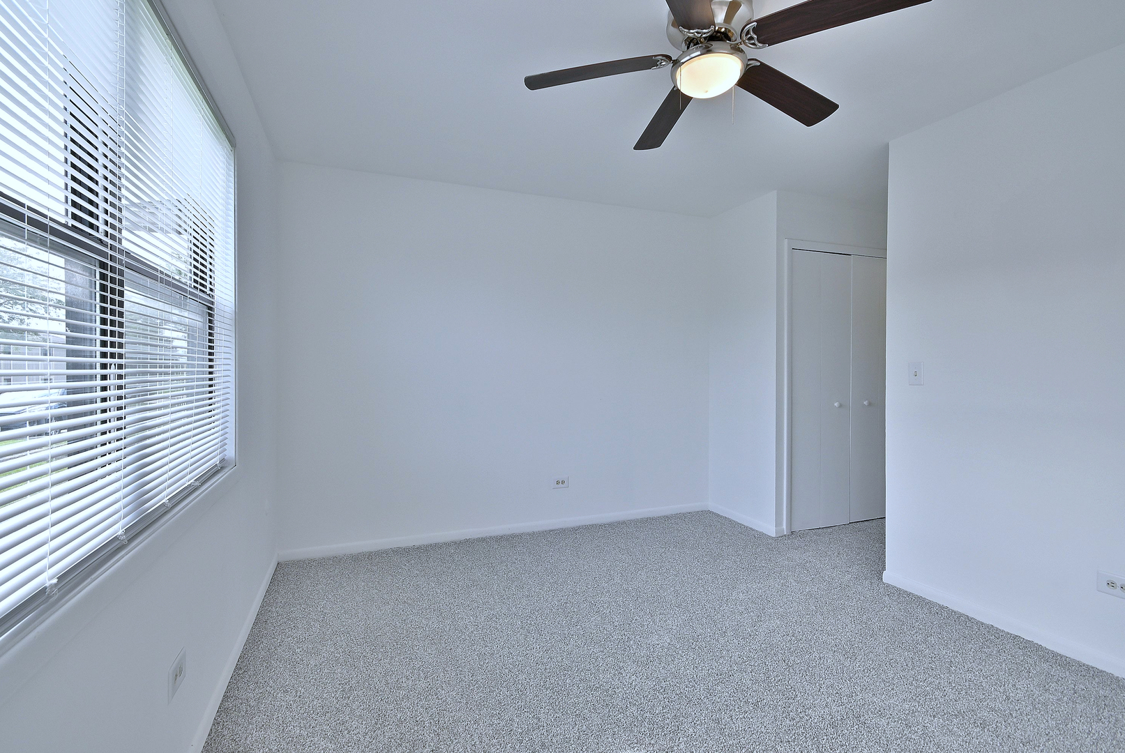 1395 Alpine Court, Unit C Hanover Park, IL 60133 - Photo 18 of 31 a view of an empty room with a window