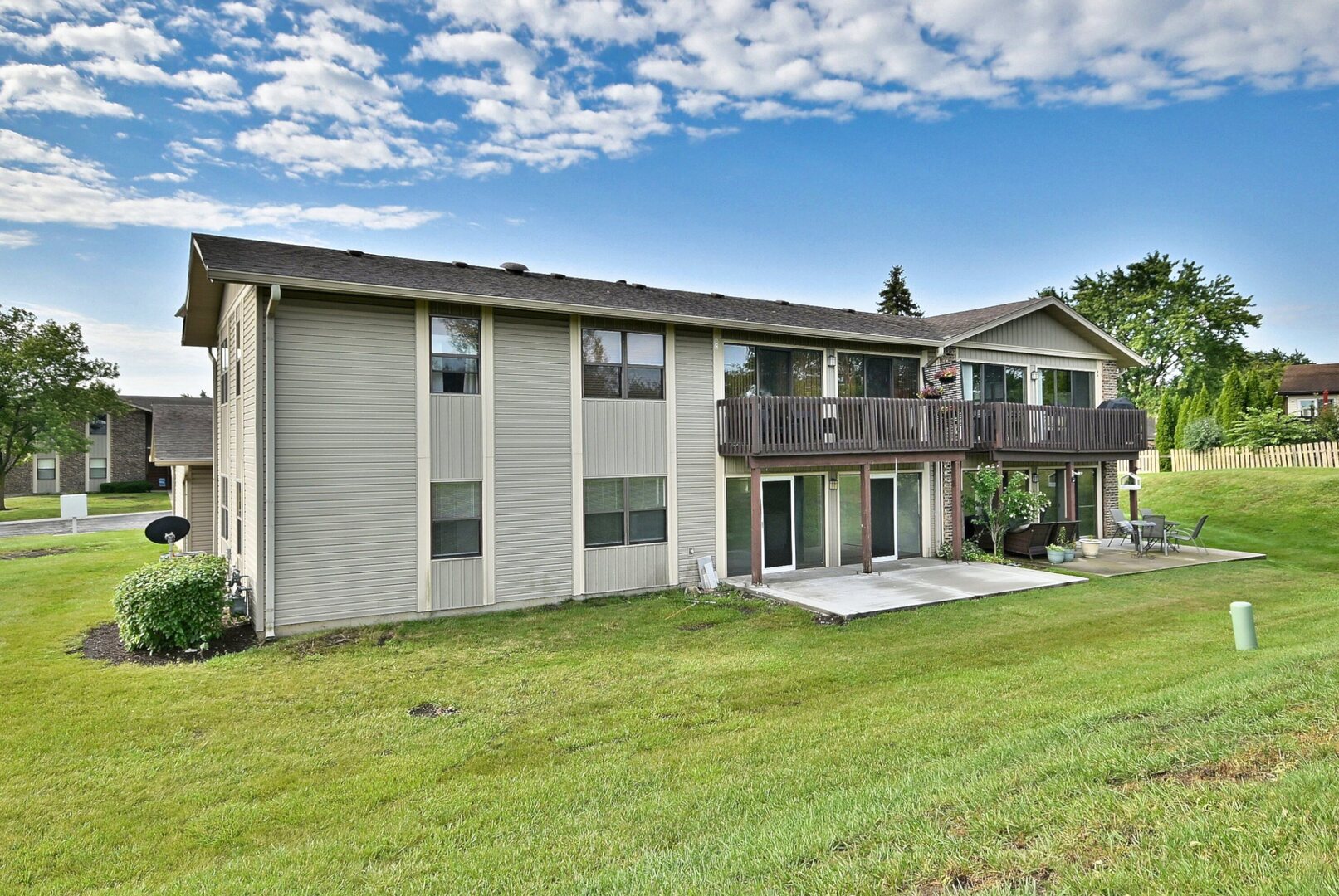 1395 Alpine Court, Unit C Hanover Park, IL 60133 - Photo 28 of 31 a front view of a house with a yard