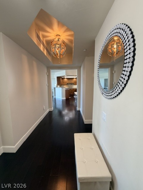 2777 Paradise Road, Unit 807 Las Vegas, NV 89109 - Photo 5 of 61 A welcoming entryway with a modern pendant light leads to an inviting kitchen beyond.