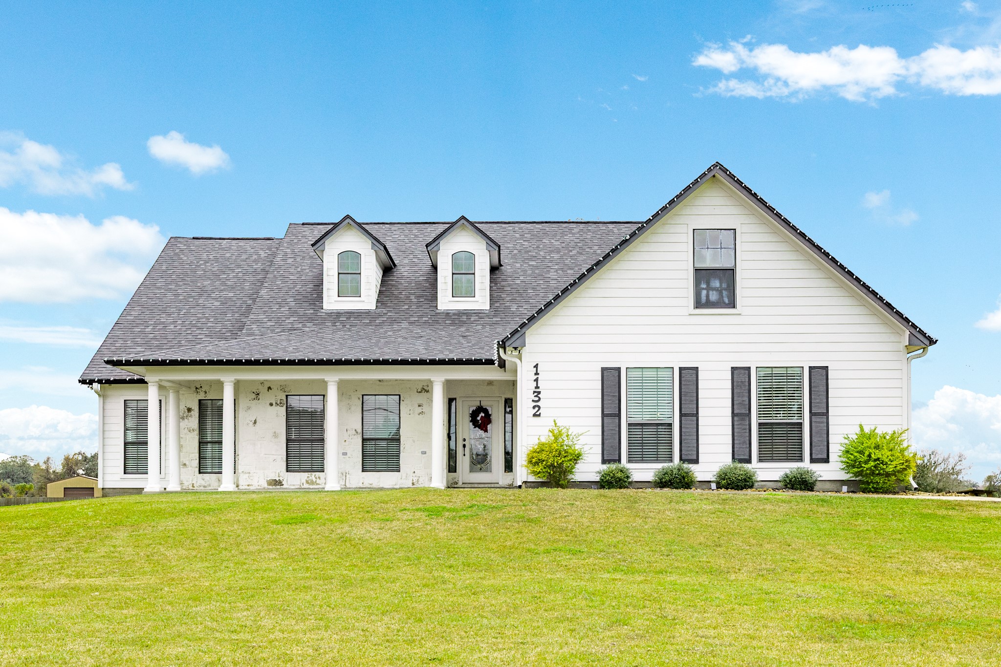 a view of a house with a swimming pool