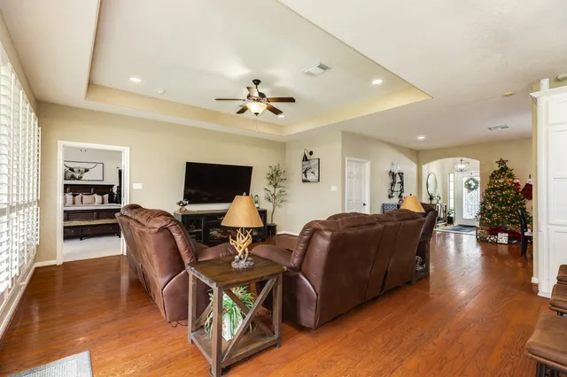 a living room with furniture and a flat screen tv