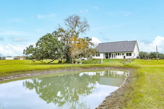 a view of a lake with a house in the background