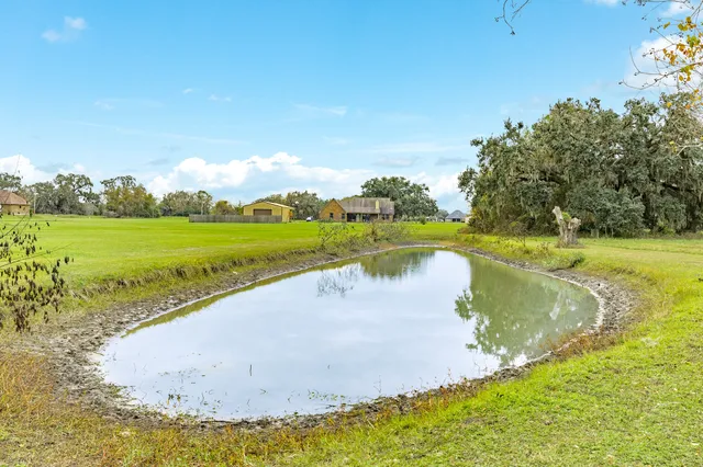 a view of a lake with a yard