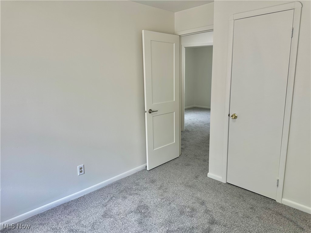 4366 Roadoan Road Brooklyn, OH 44144 - Photo 20 of 27 Unfurnished bedroom featuring carpet flooring and baseboards