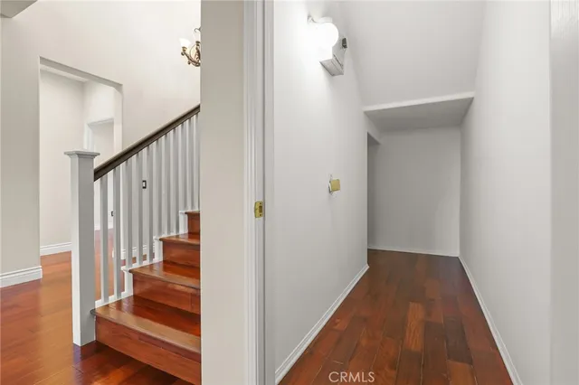 a bathroom with a granite countertop toilet a sink and shower