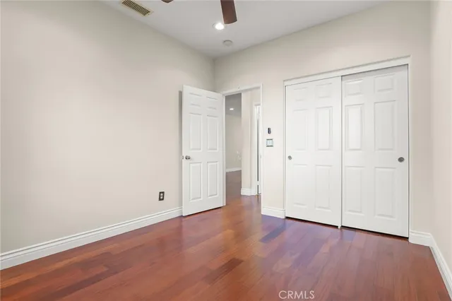 a bathroom with a granite countertop sink and a window
