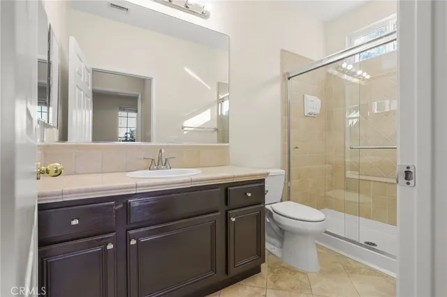 a spacious bedroom with a large bed and a window