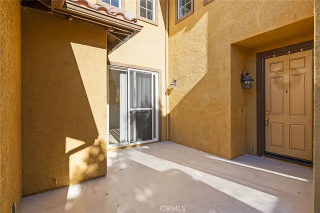 a large kitchen with a large counter top cabinets and stainless steel appliances