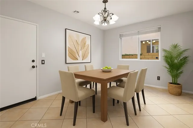 a view of an empty room with wooden floor and a ceiling fan
