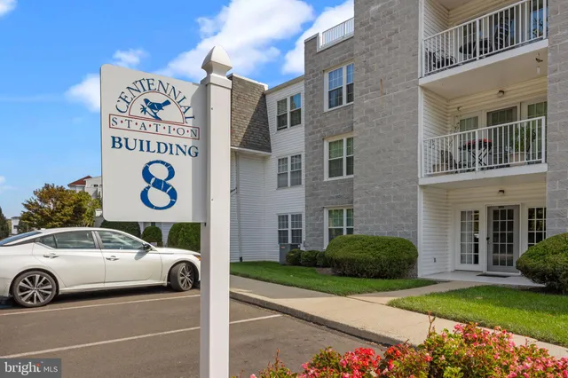 a view of a car parked in front of a building