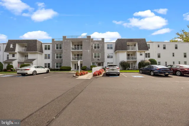 a view of a city street with a large building