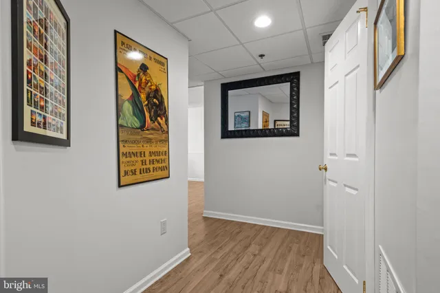 a view of an entryway with wooden floor