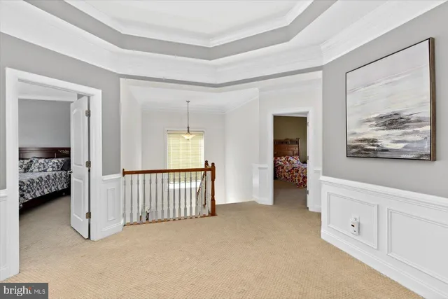 a view of a bedroom with furniture and windows