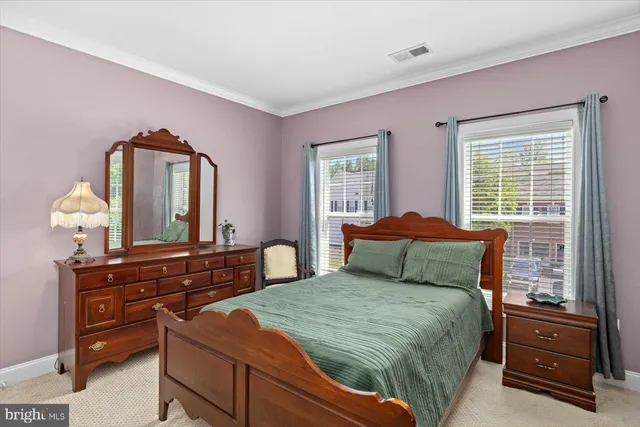 a bedroom with a bed and with furniture