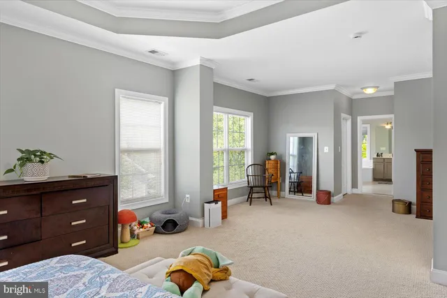 a view of a livingroom with furniture and a window