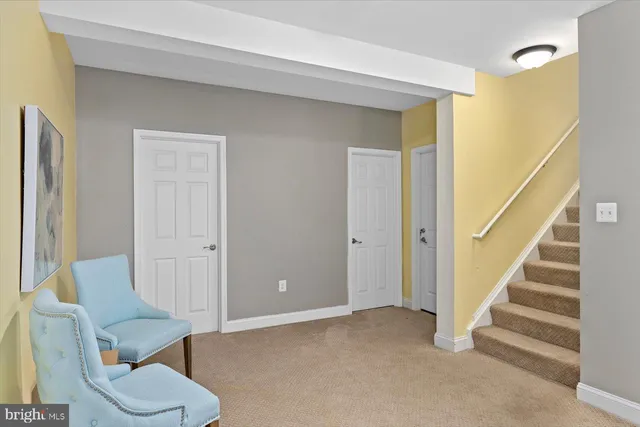a bathroom with a toilet tub sink vanity and a mirror