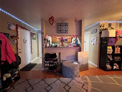 a living room with lots of furniture and a flat screen tv