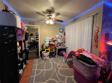 a bed room with a bed and a chandelier