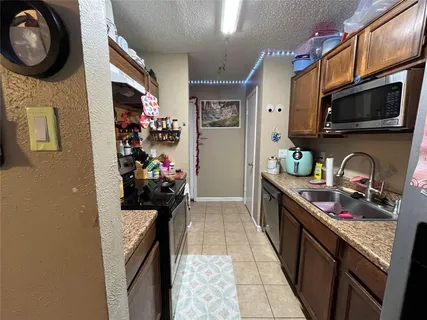 a view of a street with a cars park