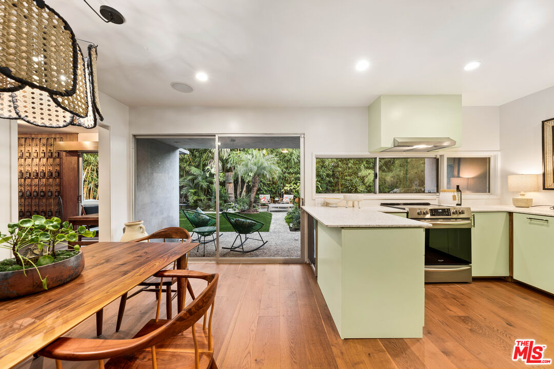 1116 Berkeley Drive Venice, CA 90292 - Photo 14 of 30 a kitchen with stainless steel appliances granite countertop a stove and a refrigerator