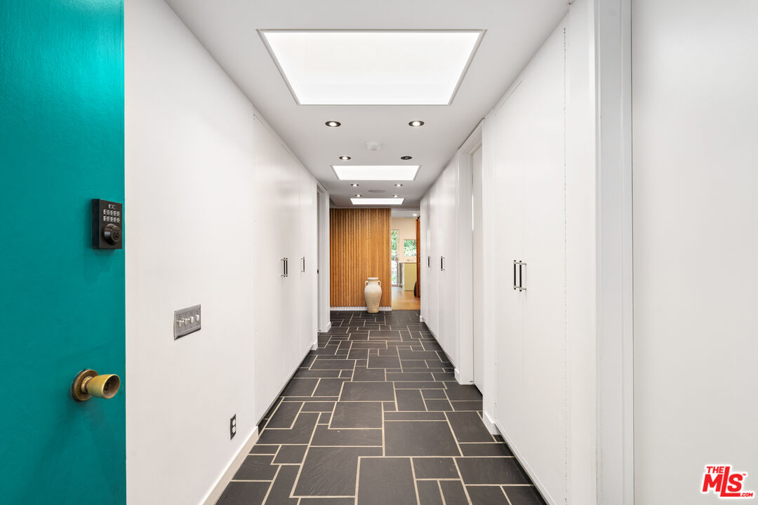 1116 Berkeley Drive Venice, CA 90292 - Photo 3 of 30 a view of a hallway with wooden floor and a living room