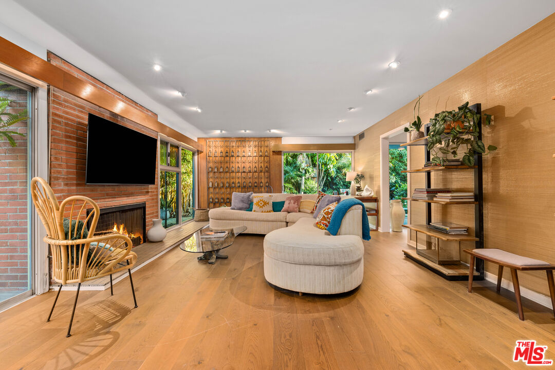 1116 Berkeley Drive Venice, CA 90292 - Photo 6 of 30 a living room with furniture and a flat screen tv