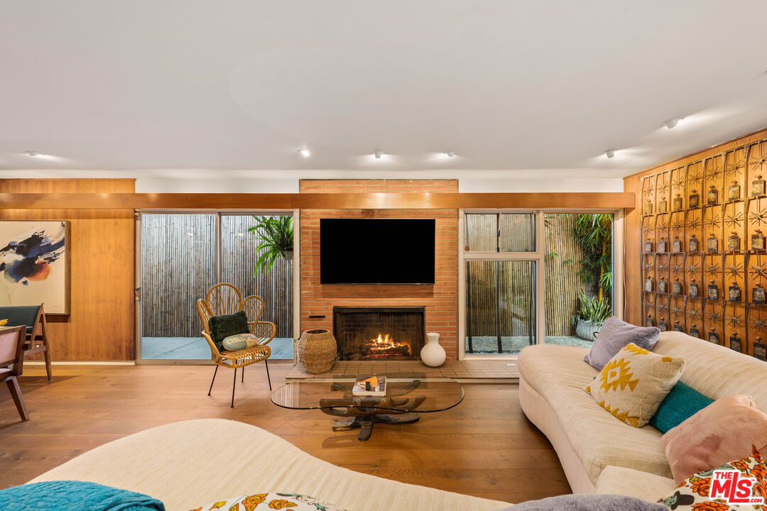1116 Berkeley Drive Venice, CA 90292 - Photo 7 of 30 a living room with furniture fireplace and a flat screen tv