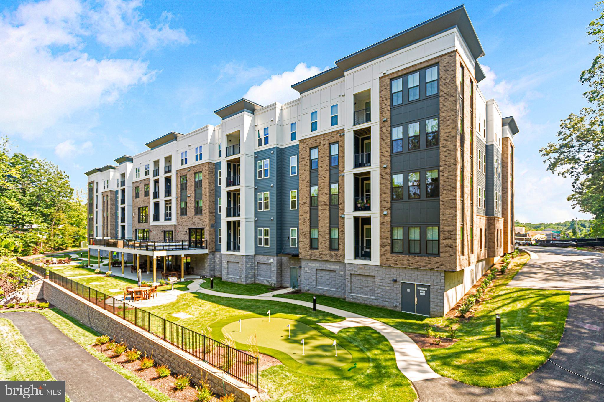 76 Old Mill Bottom Road North, Unit 301 Annapolis, MD 21409 - Photo 1 of 37 a view of a building with a swimming pool