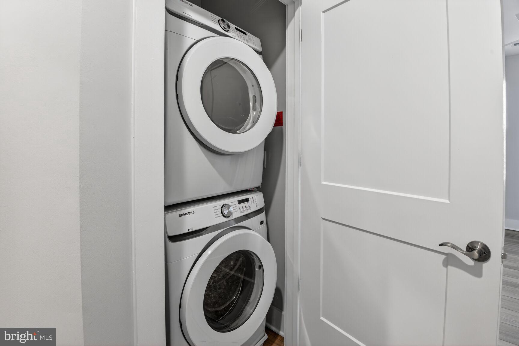 76 Old Mill Bottom Road North, Unit 301 Annapolis, MD 21409 - Photo 14 of 37 a close up view of a washer and dryer in a small bathroom