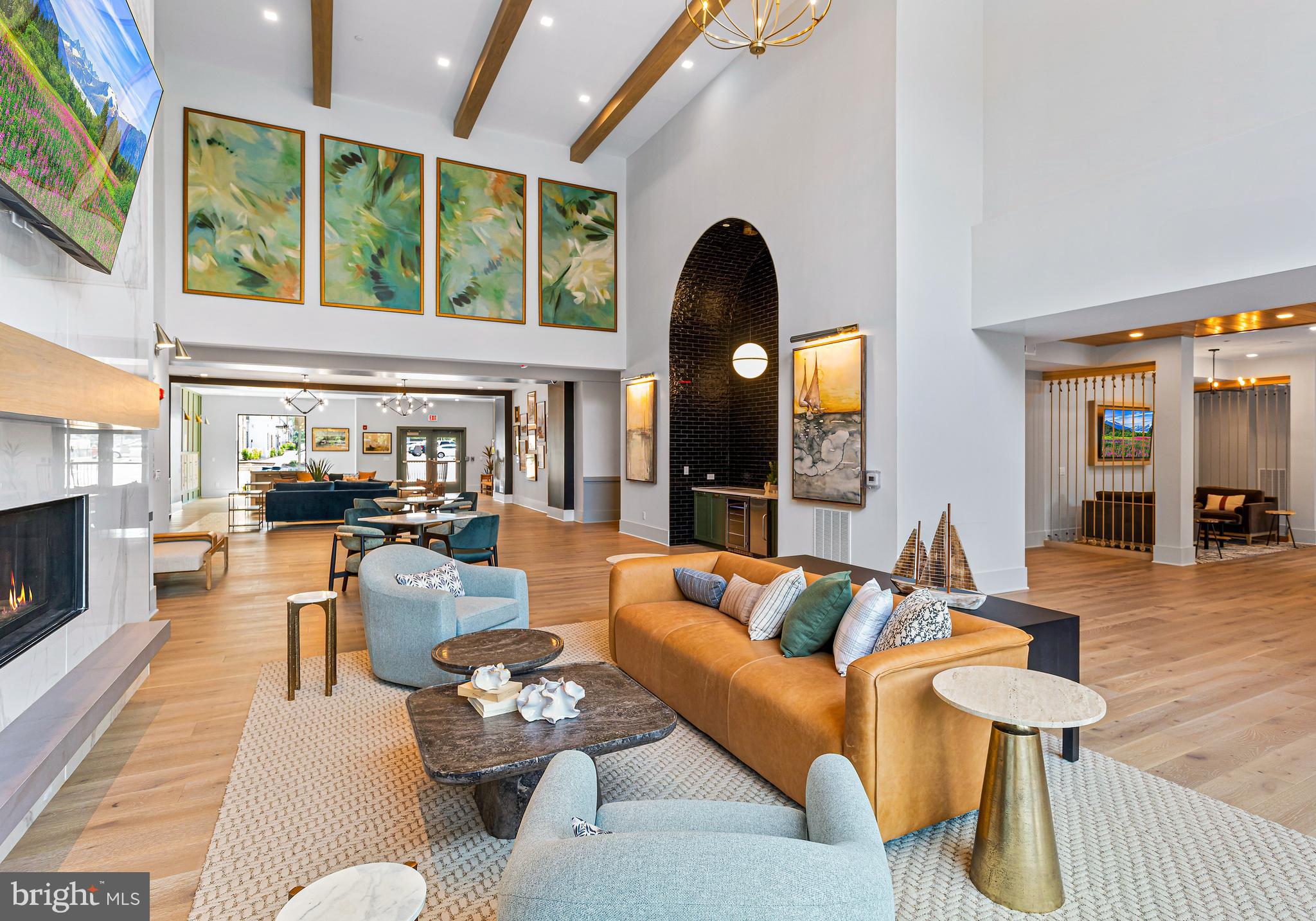76 Old Mill Bottom Road North, Unit 301 Annapolis, MD 21409 - Photo 16 of 37 a living room with furniture fireplace and a large window