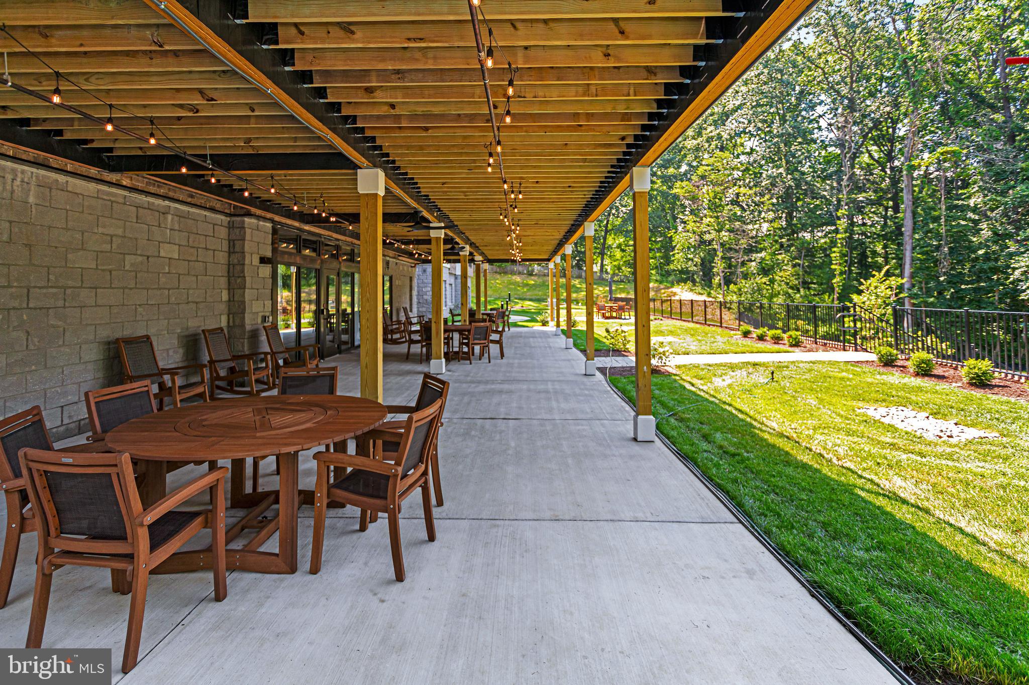 76 Old Mill Bottom Road North, Unit 301 Annapolis, MD 21409 - Photo 25 of 37 a view of a patio with table and chairs and potted plants