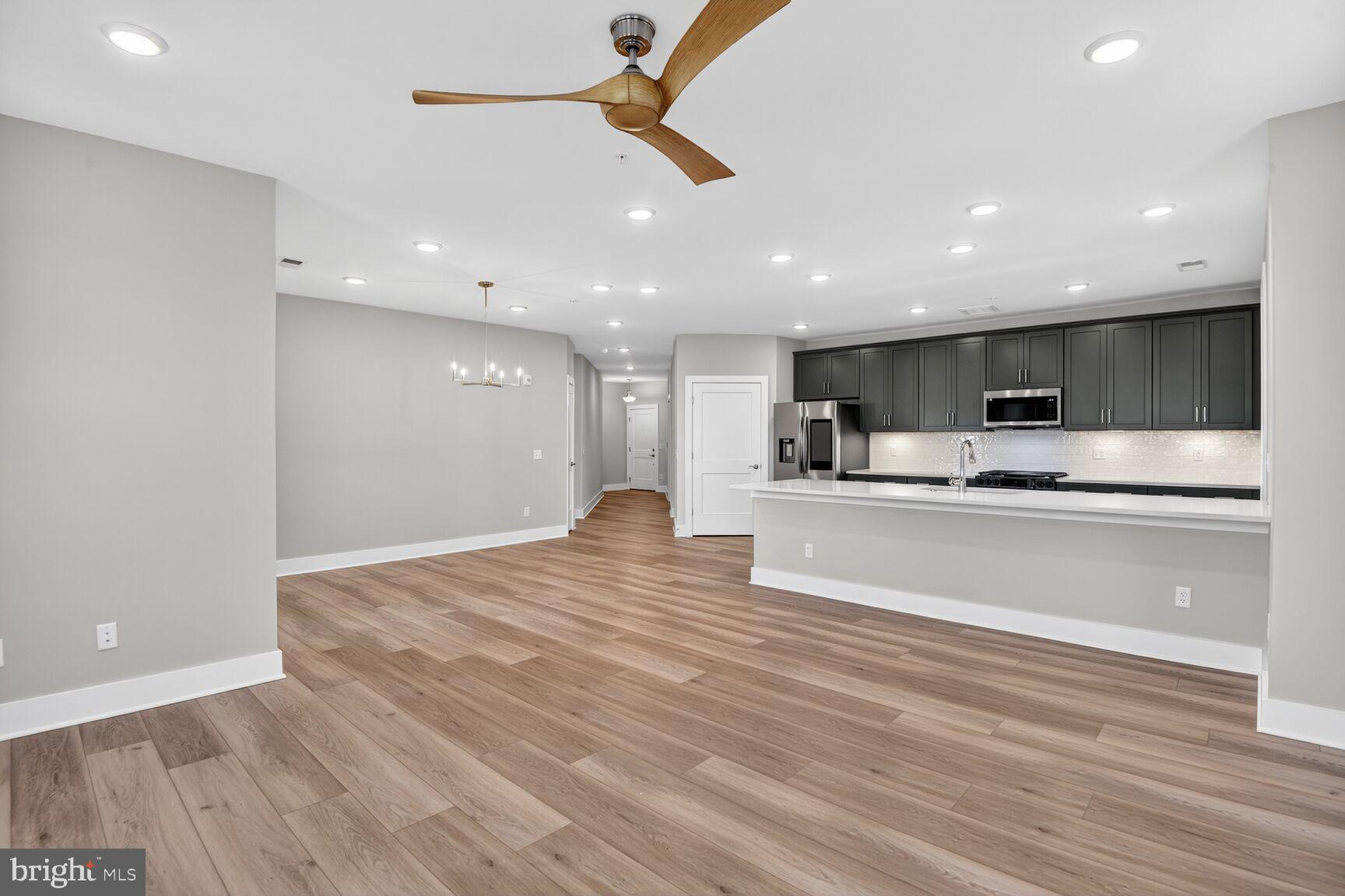 76 Old Mill Bottom Road North, Unit 301 Annapolis, MD 21409 - Photo 8 of 37 a view of kitchen with kitchen island sink and center island