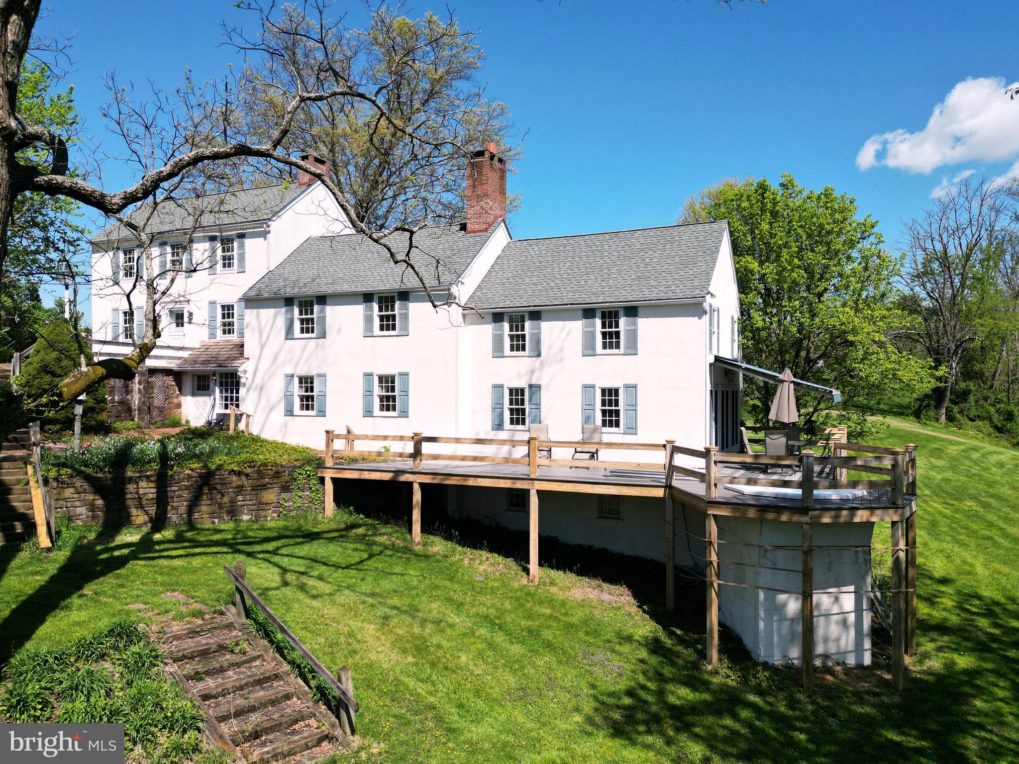 a backyard of a house with yard and outdoor seating
