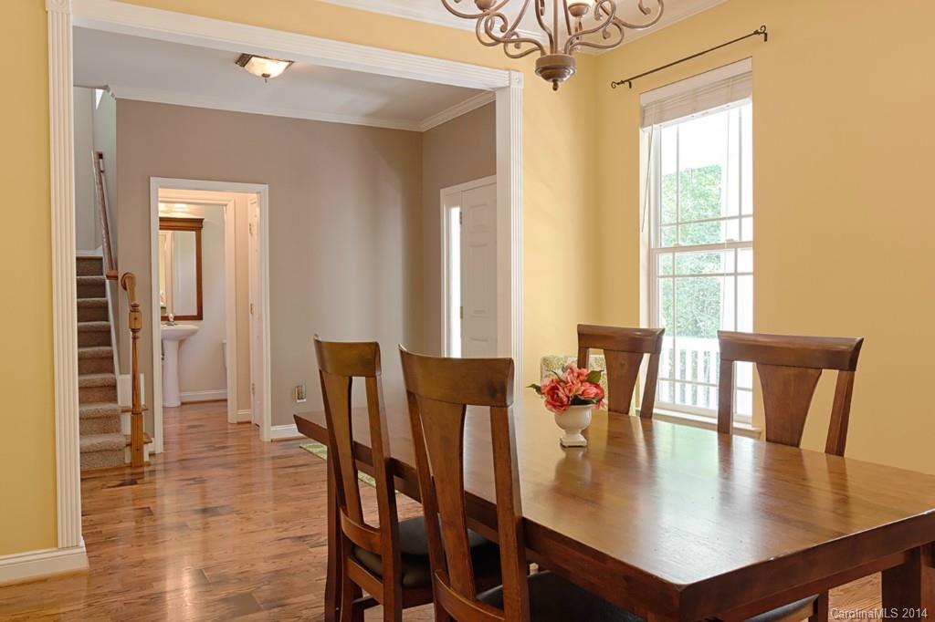 6312 Hastings Road Waxhaw, NC 28173 - Photo 2 of 24 a view of a dining room with furniture and wooden floor