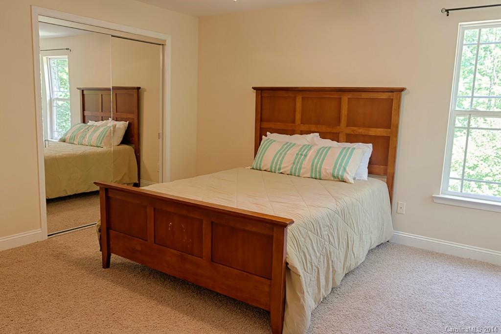 6312 Hastings Road Waxhaw, NC 28173 - Photo 17 of 24 a bedroom with a bed and a mirror