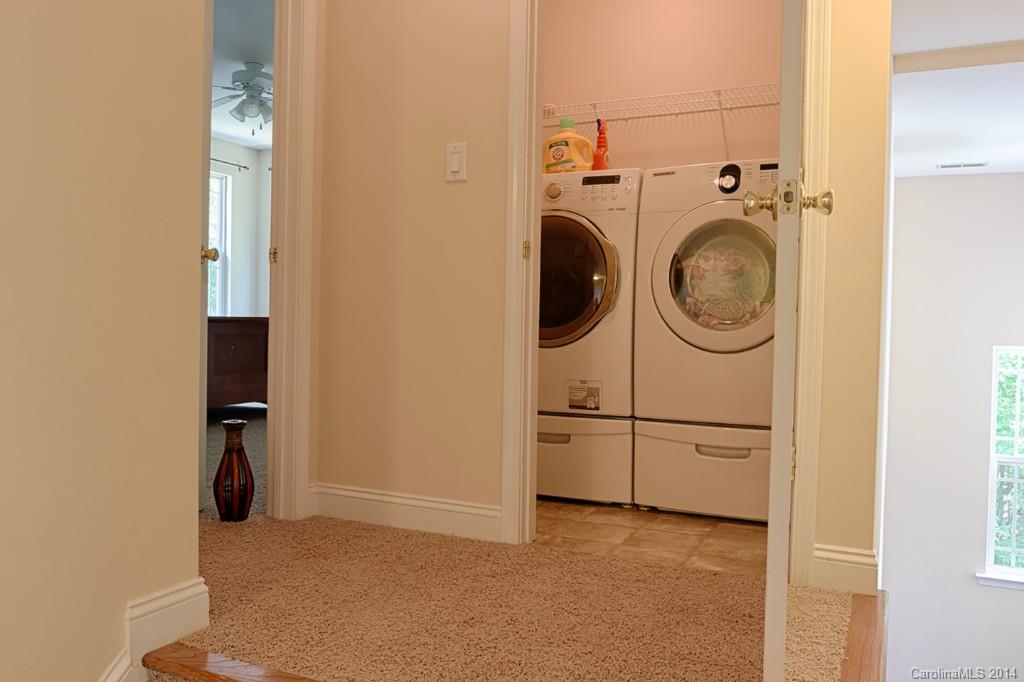 6312 Hastings Road Waxhaw, NC 28173 - Photo 22 of 24 a view of a storage & utility room with washer and dryer