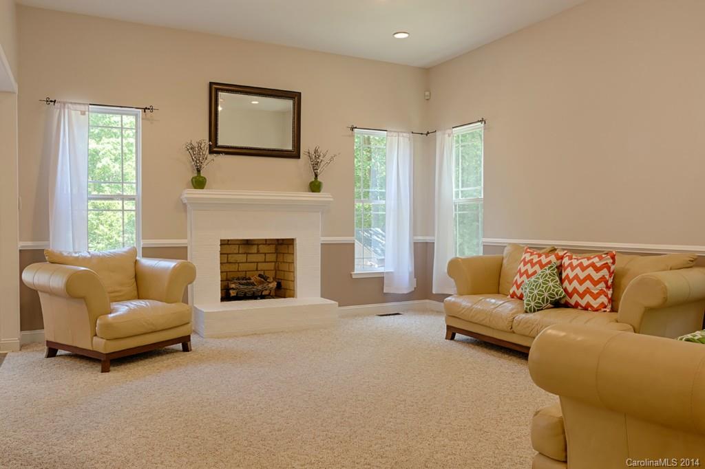 6312 Hastings Road Waxhaw, NC 28173 - Photo 6 of 24 a living room with furniture and a fireplace
