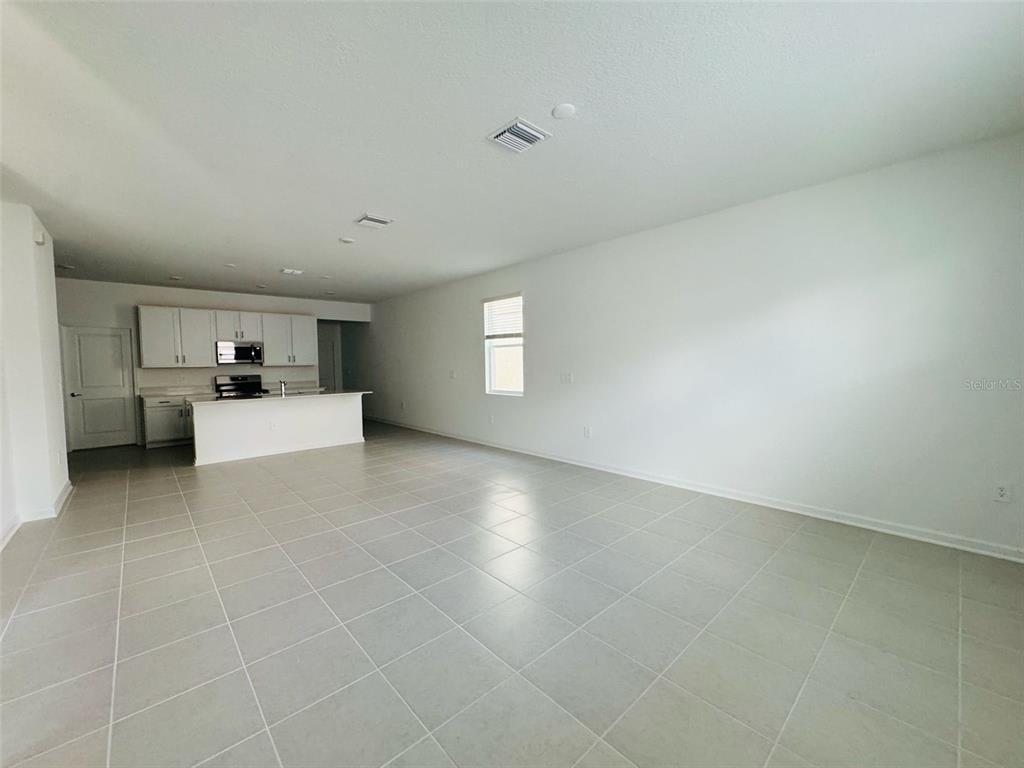 2473 Spring Tune Alley Kissimmee, FL 34744 - Photo 15 of 27 a view of a livingroom with furniture and cabinet