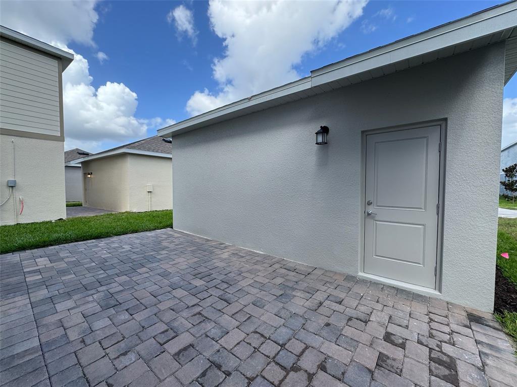 2473 Spring Tune Alley Kissimmee, FL 34744 - Photo 27 of 27 a backyard of a house