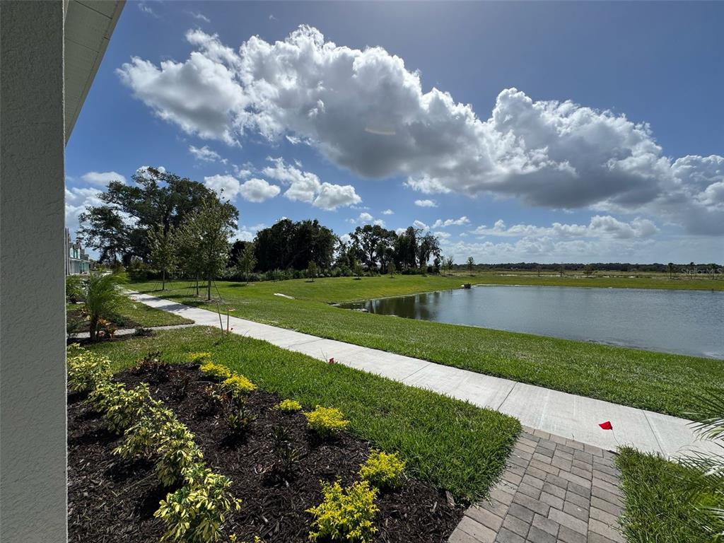 2473 Spring Tune Alley Kissimmee, FL 34744 - Photo 6 of 27 a view of a golf course with a lake