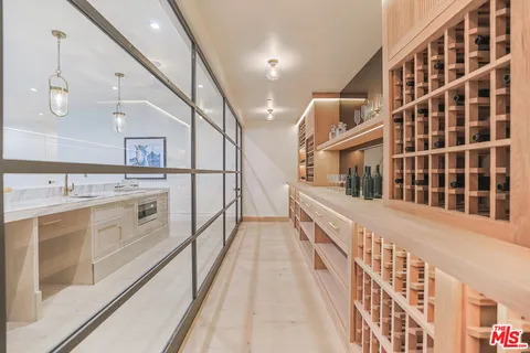 a view of a kitchen with a sink and wooden floor