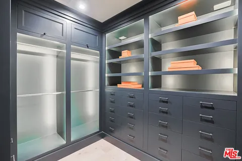 a kitchen with a refrigerator and cabinets